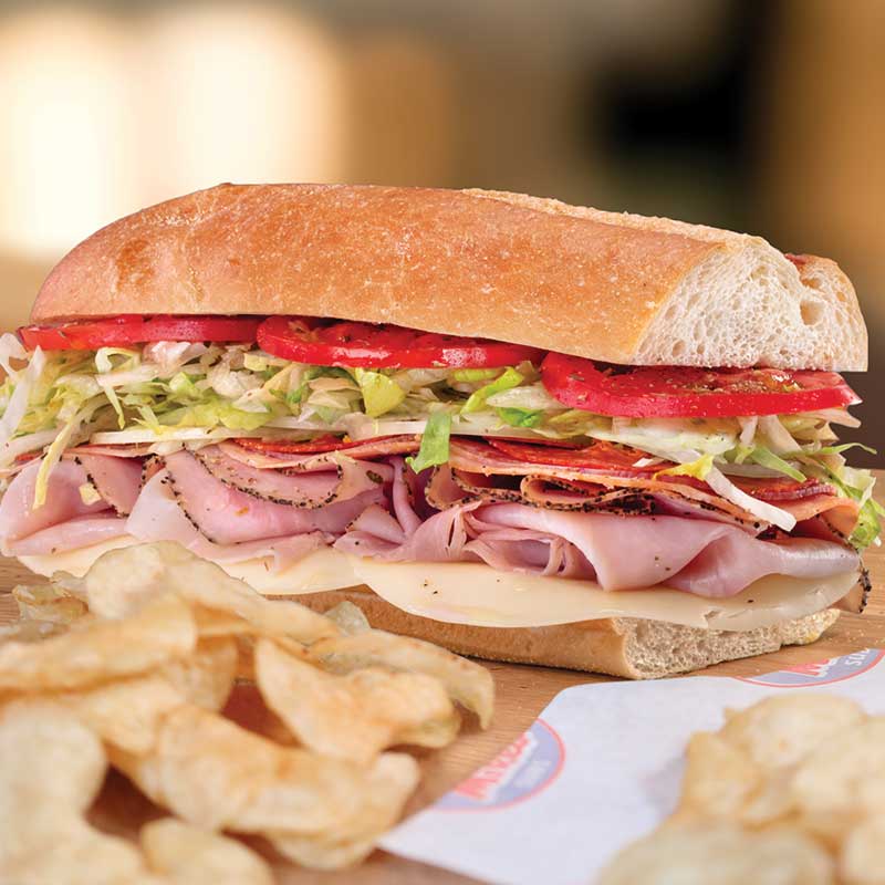 A classic Jersey Mike's cold sub piled with fresh-sliced meats, lettuce, and tomato