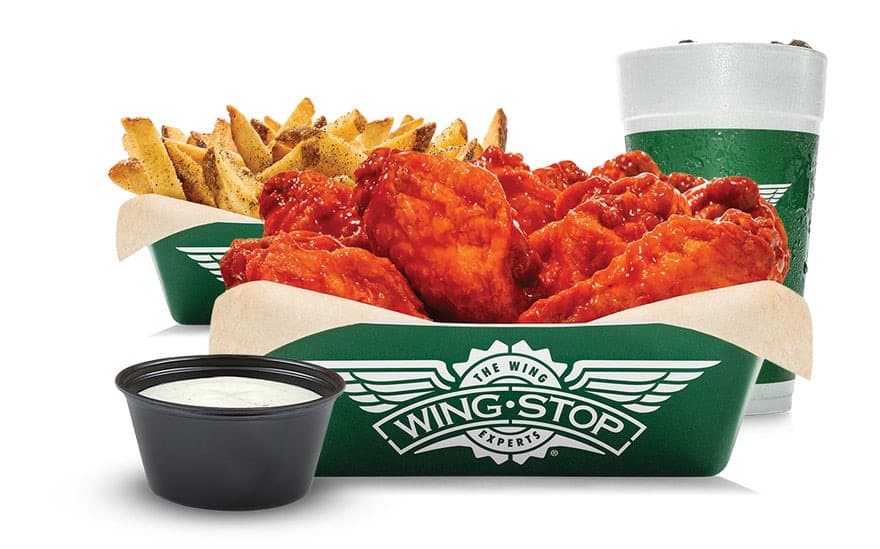 A Wingstop classic combo — saucy wings, seasoned fries, ranch, and a branded drink
